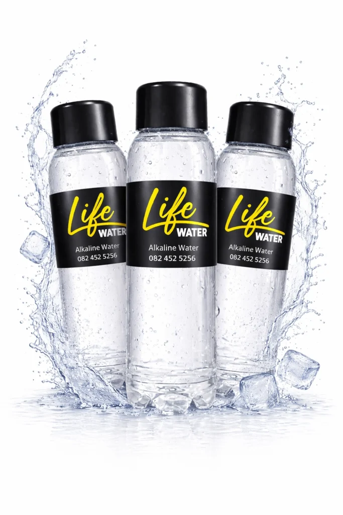 Three Life Companion alkaline water bottles with water splash and ice on a white background